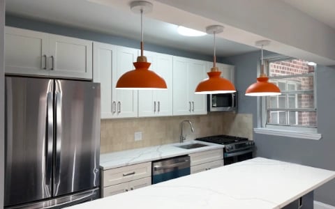 Woodside kitchen renovation Queens - 1930s layout optimization with white shaker cabinets and granite countertops